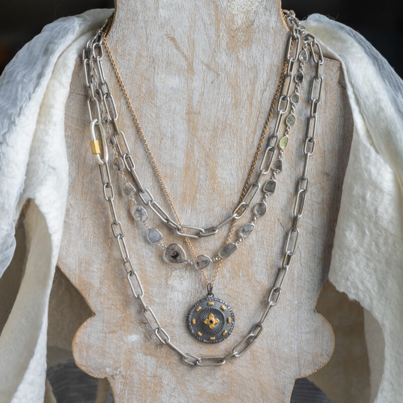 Circular Rhodium and Gold Pendant Necklace with Small Quatrefoil Pattern