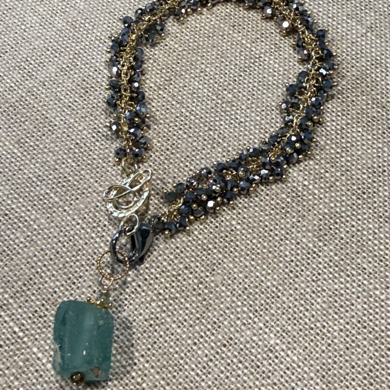 Hand-tied, faceted pyrite balls on gold wire bracelet