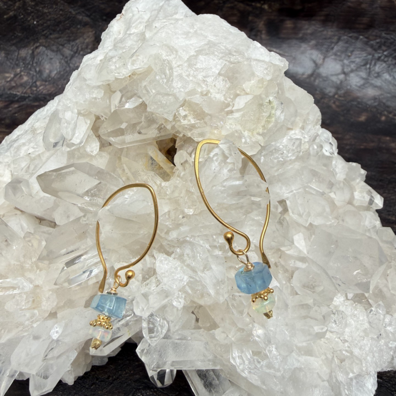 Aquamarine and opal earrings with gold details on long thin gold tops