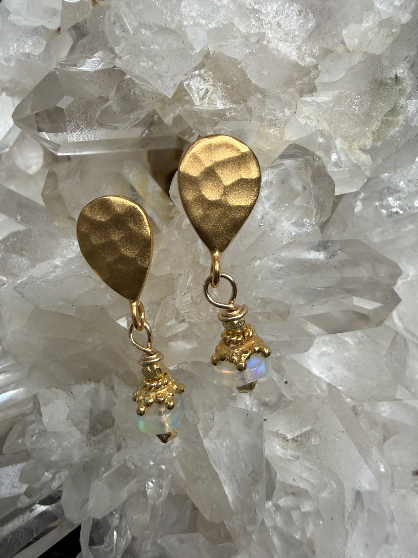 Opals with gold details on hammered gold tops