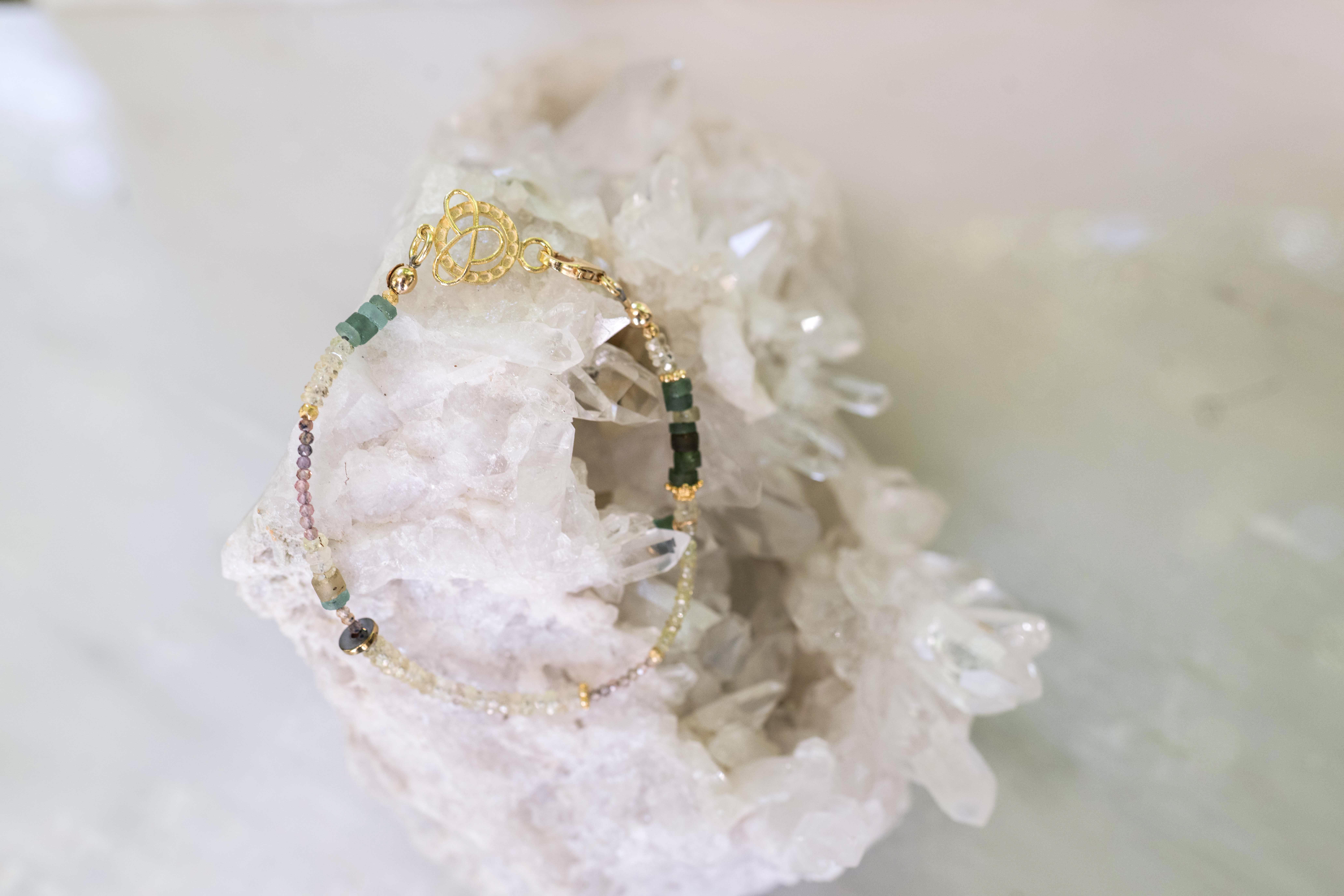 Yellow sapphires with Roman glass, gold, and hematite (roman glass dangle), 7.5"