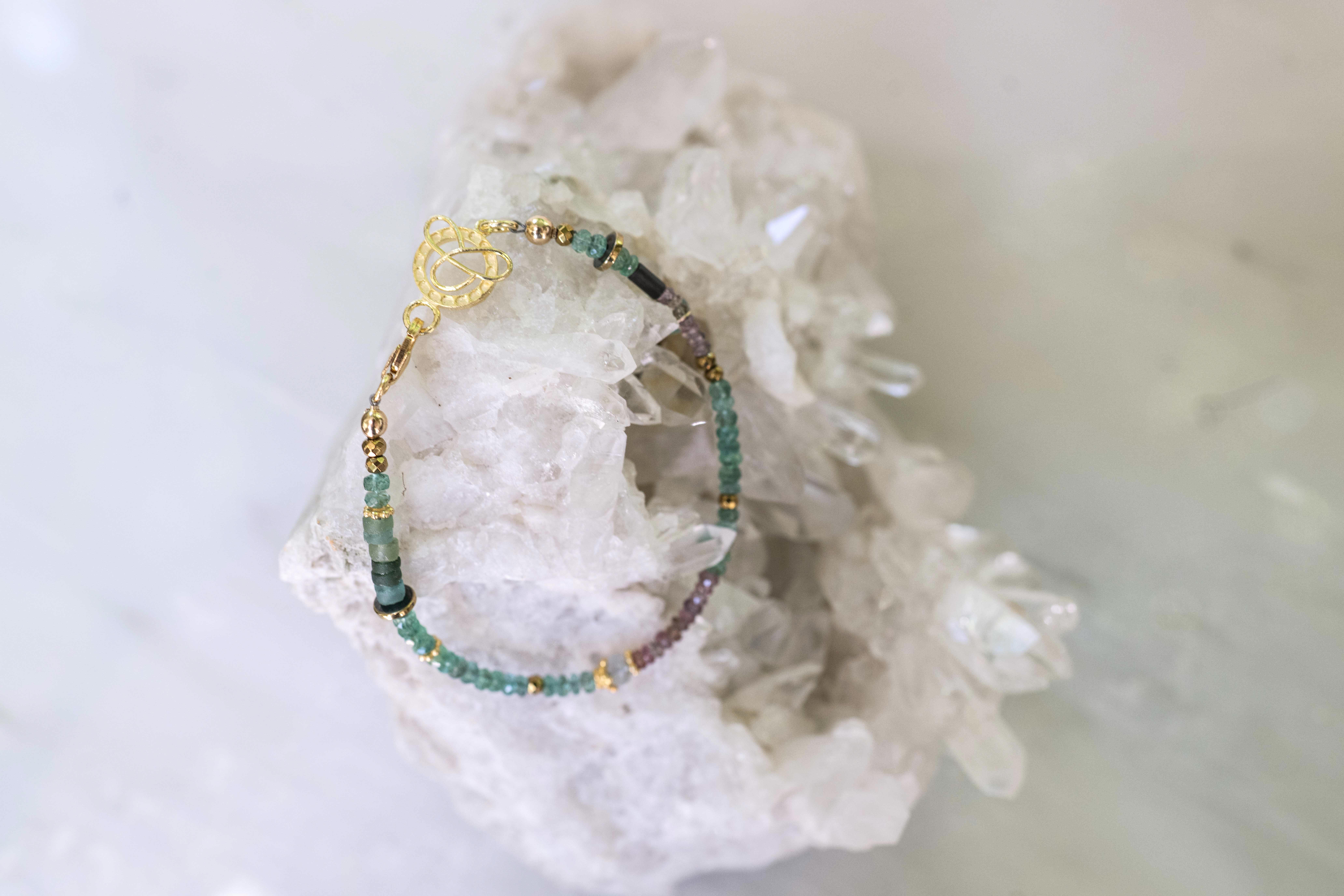 Green and multicolored sapphire with hematite, gold and Roman glass details, 7.5"